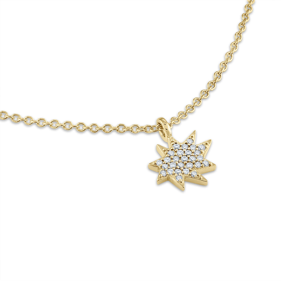 A mini star necklace in pave diamonds and 14K yellow gold.
