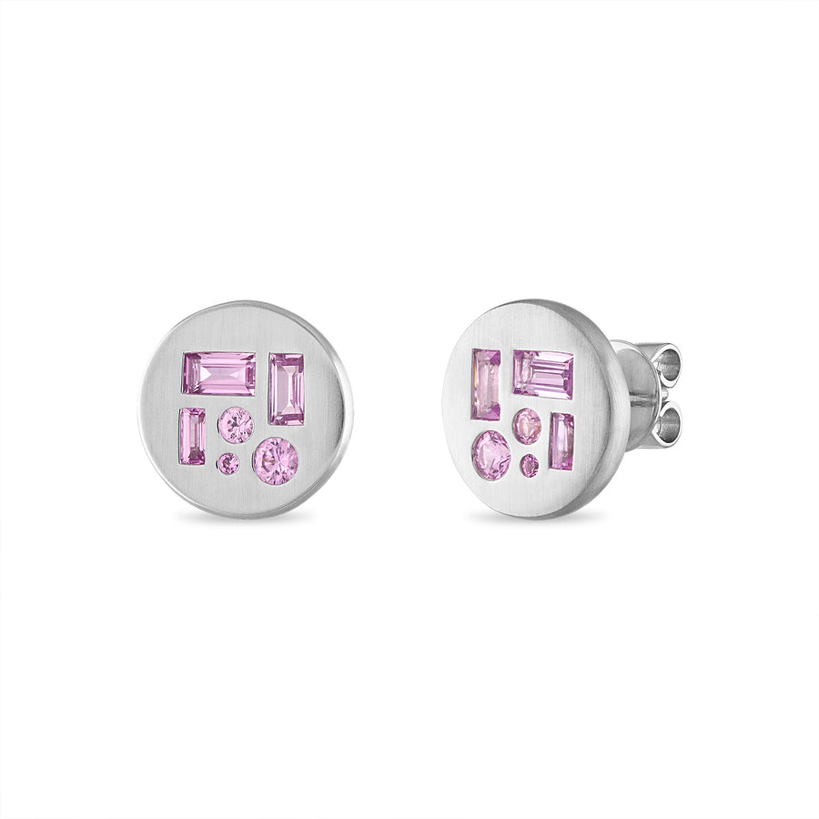 Stud earrings featuring alternating shapes of pink sapphires in 18K white gold.