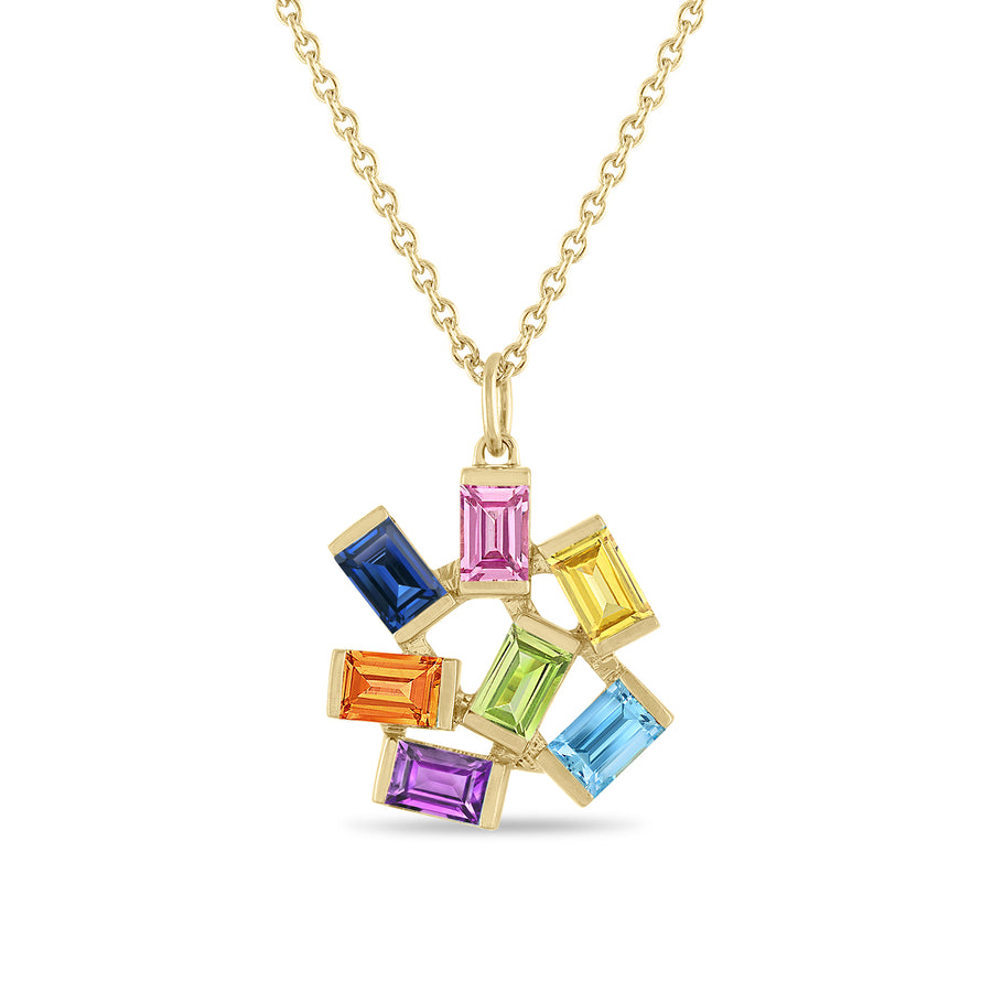 A pendant necklace featuring a cluster of rainbow gemstones in 14K yellow gold.